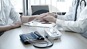 Image of doctor holding patient`s hand to encourage, talking with patient cheering and support, healthcare and medical assistant