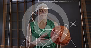 Image of drawing of game plan over caucasian female basketball player