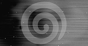 Image of dust and scratches moving over streaking black and grey lines background photo