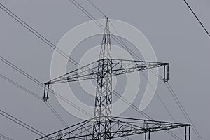 image of an electricity pylon on a bright cloudy day