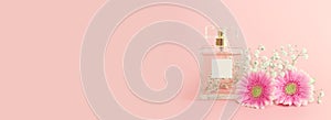 Image of elegant perfume bottle over pink pastel background