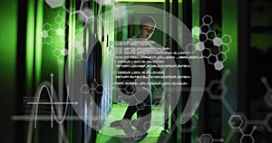 Image of elements, charts and processing data over asian male technician working in server room