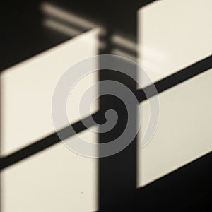 The image emphasizes minimalism through the use of light shadow and geometry