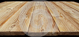 Image of empty wooden table top isolated on black background