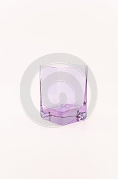 image of emty modern design drinking glass isolated on a white table surface