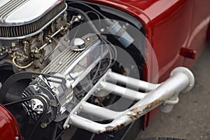 Image of the engine of the old car. Dual carburetor