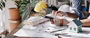 Image of engineer drawing a blue print design building or house, An engineer workplace with blueprints, pencil