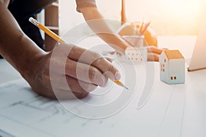 Image of engineer drawing a blue print design building or house