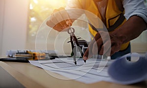 Image of engineer meeting for architectural project. working with partner and engineering tools on workplace vintage tone