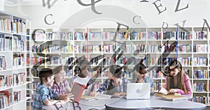 Image of english text over schoolchildren using laptop