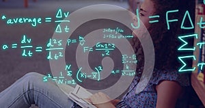 Image of equations and data processing over biracial female student reading