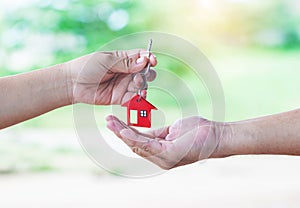 Image of estate agent giving house keys to man