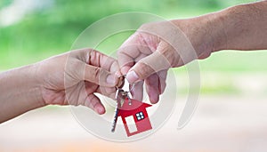 Image of estate agent giving house keys to woman