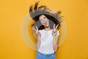Image of european woman 20s laughing and having fun with shaking