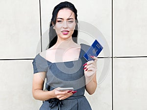 Image of European Woman Having Beautiful Brown Hair Smiling While Holding Passport and Air Tickets