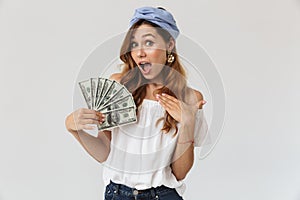 Image of excited joyful woman 20s rejoicing and holding fan of d