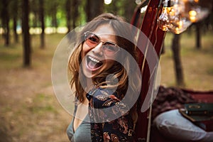 Image of excited woman 20s, wearing stylish accessories smiling