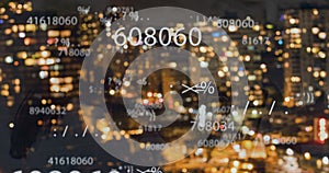 Image of falling numbers over night cityscape