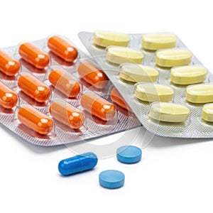 Assorted pills and tablets, isolated on white background