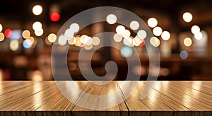 Warm bokeh lights shine over glossy wood surface