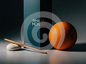 Rima mon box, orange, and incense on white background