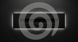 A sleek black rectangular object with glowing light on a dark background