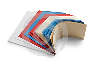 Stack of colored paper sheets isolated on white background