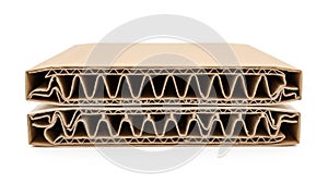 Stack of corrugated cardboard sheets isolated on white background