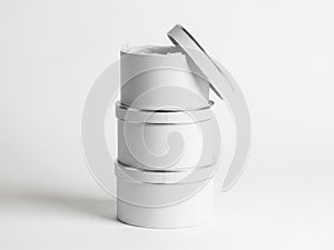 Stack of white cylindrical containers isolated on white background