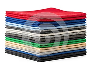 Stack of colored fabrics isolated on white background