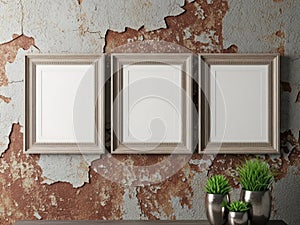 Three empty frames on distressed wall, isolated on white background