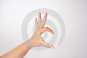 The image features a three-fingered hand on a white background