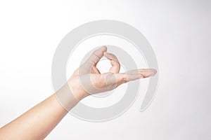 The image features a three-fingered hand on a white background
