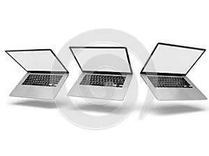 Three laptops in different angles isolated on white background