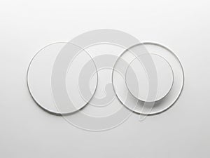 White circular objects on a plain white background isolated on white background