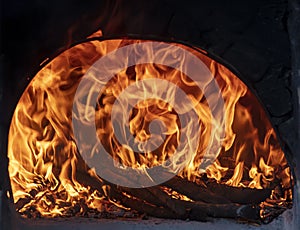 Image of a fiery and flaming brick oven. Firewood in the furnace