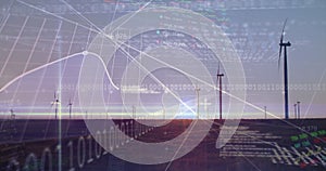 Image of financial data processing binary coding over wind turbines