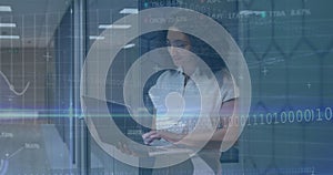 Image of financial data processing over businesswoman using computer