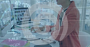 Image of financial data processing over businesswoman using computer