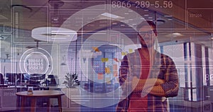 Image of financial data processing over caucasian businessman working at office