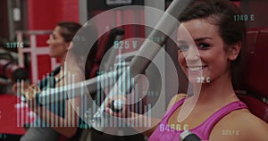 Image of financial data processing over caucasian woman exercising in gym