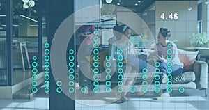 Image of financial data processing over diverse business people discussing work at office