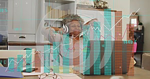 Image of financial data processing over senior african american woman using laptop