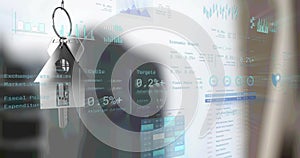 Image of financial data processing over silver key and keyfob