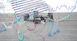 Image of financial data processing over stacks of coins
