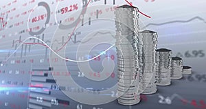 Image of financial data processing over stacks of silver coins