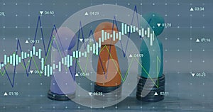 Image of financial data processing over three pawns and stacks of coins