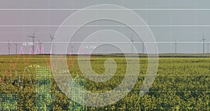Image of financial data processing over wind turbines