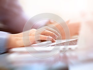 Image of a finger being about to press a key on a laptop keyboard