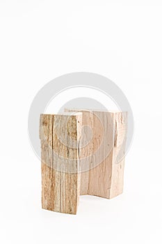 image with firewood logs isolated on a white table surface